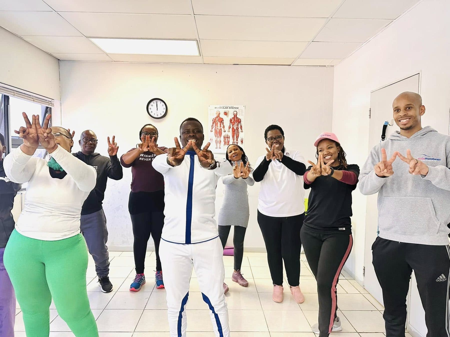 A Grace Physiotherapy exercise rehabilitation class working through a strength routine together.